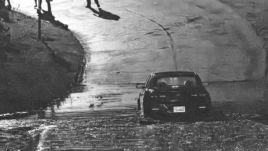 CAR SWAMPED ON LOW-WATER BRIDGE