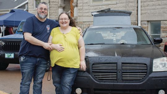 Community car show goes on despite rain