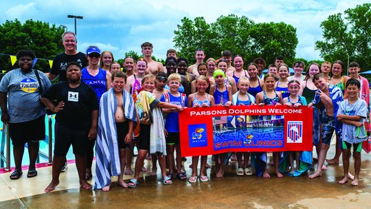 Dolphins bring in KU coach for swimming clinic