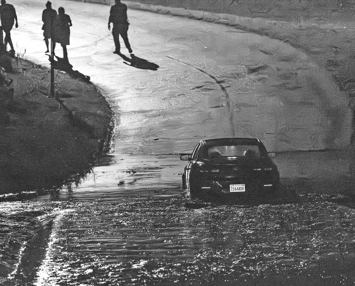 CAR SWAMPED ON LOW-WATER BRIDGE
